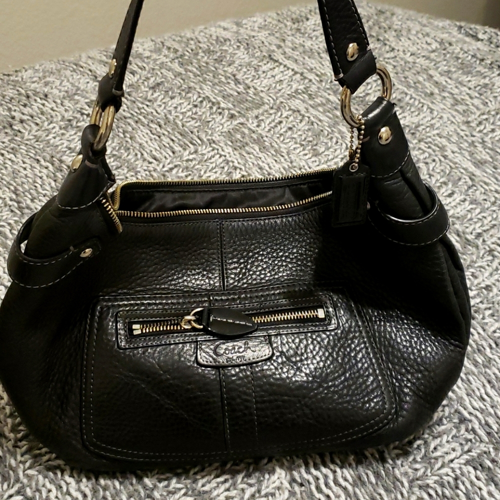 Coach pebbled leather hobo handbags.